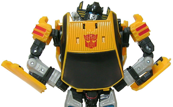 Yellow Generation 1 Sunstreaker with closed hands on the hips and head tilted to the left