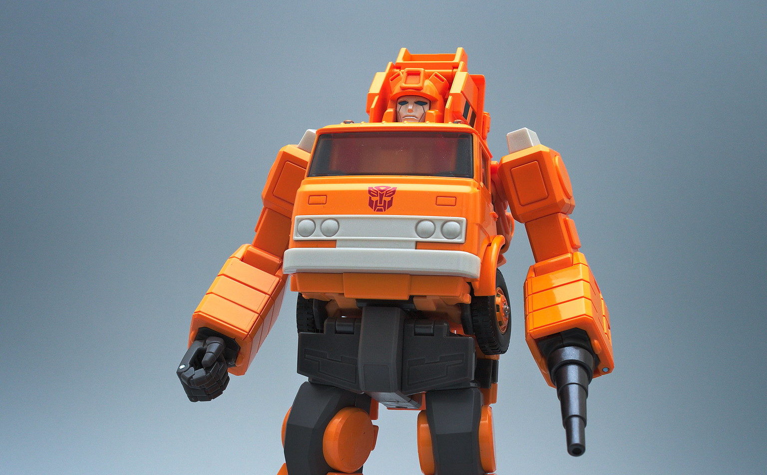 Orange Grapple with black wrist barrel attachment in replacement of his left fist