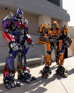 Two persons in Transformers costume standing side by side