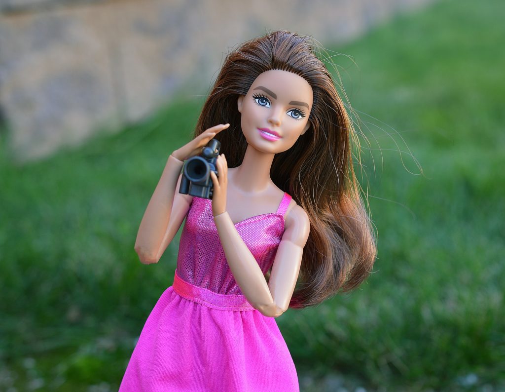 Barbie holding a camera