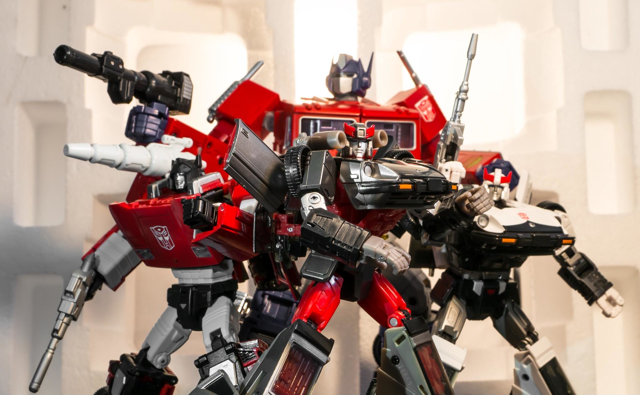 Four Autobots molded in red, white, and\black
