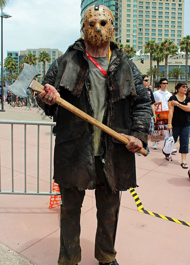 cosplayer of Friday the Thirteenth character holding an axe