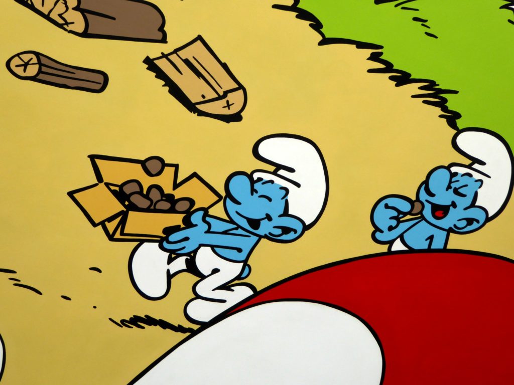 Greedy Smurf (left) carrying an open box full of cakes