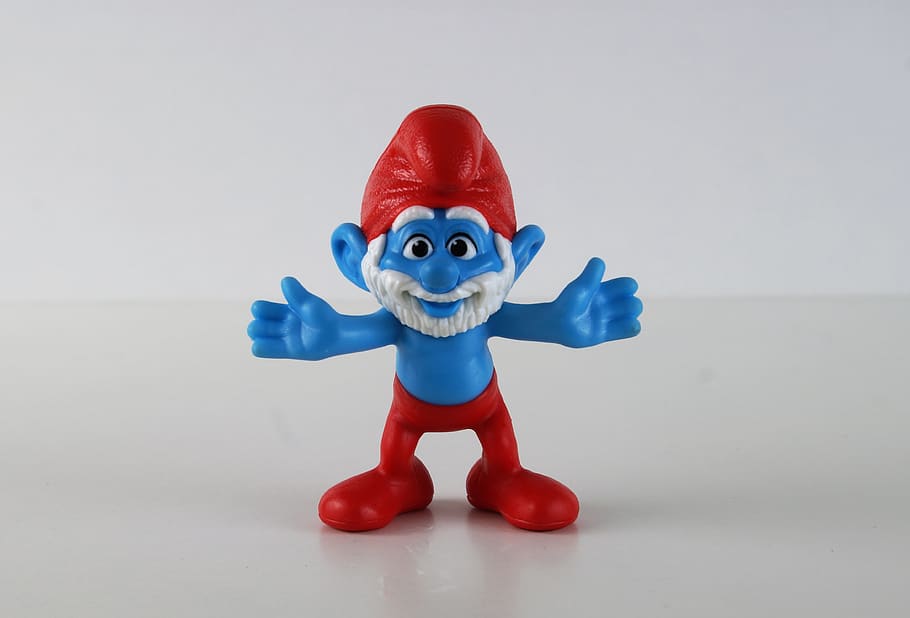 Papa Smurf with red cap and pants and a white full beard