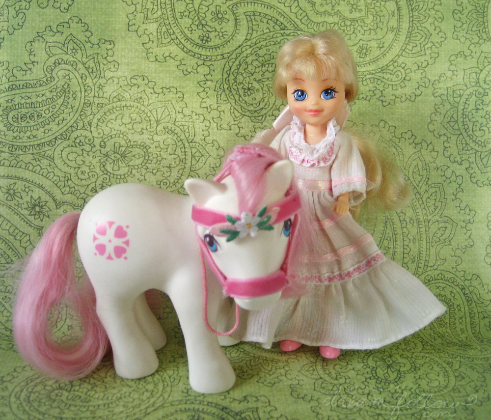 Megan of My Little Pony with her white Little Pony with pink hair and tail