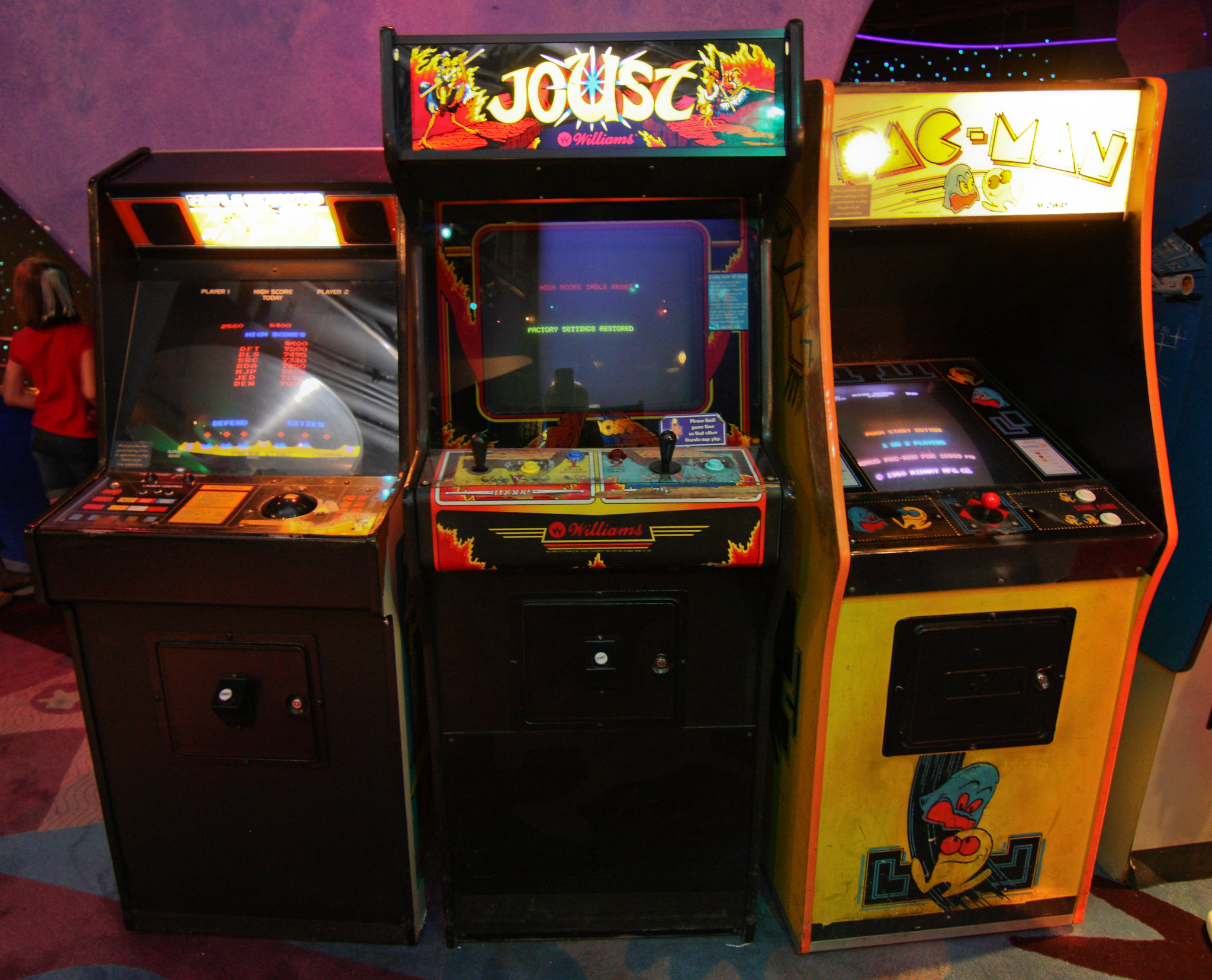 Joust and Pac Man Arcade Games next to each other