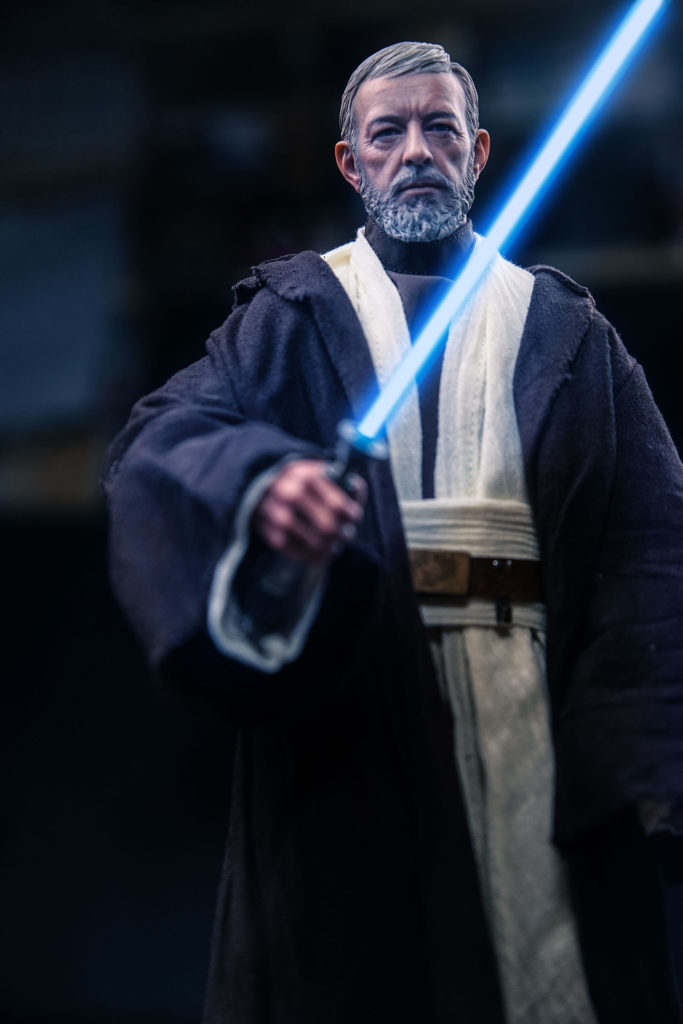 Obi Wan holding a blue lightsaber