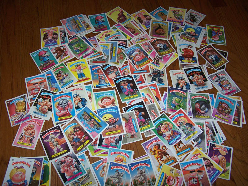A lot of laid out GPK cards on a wooden floor