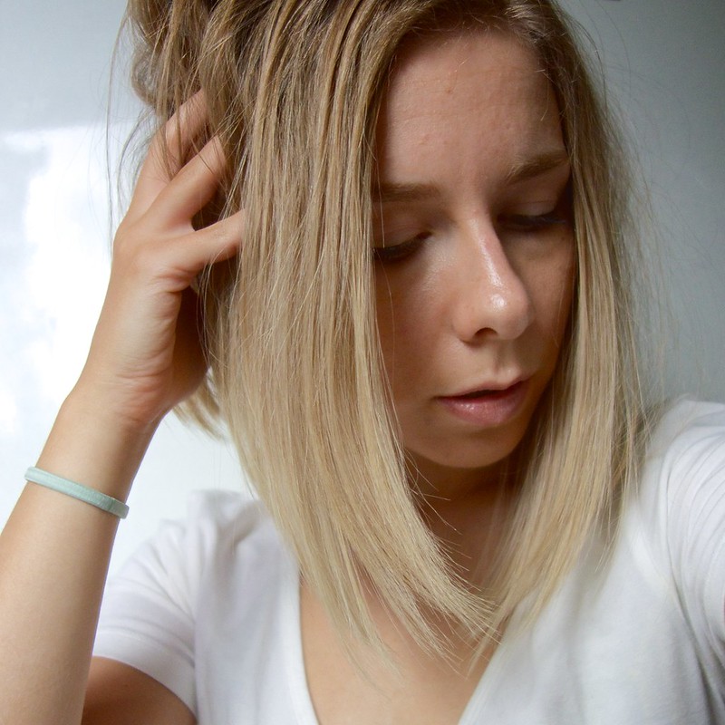 A blonde woman with a short Asymmetrical Hair