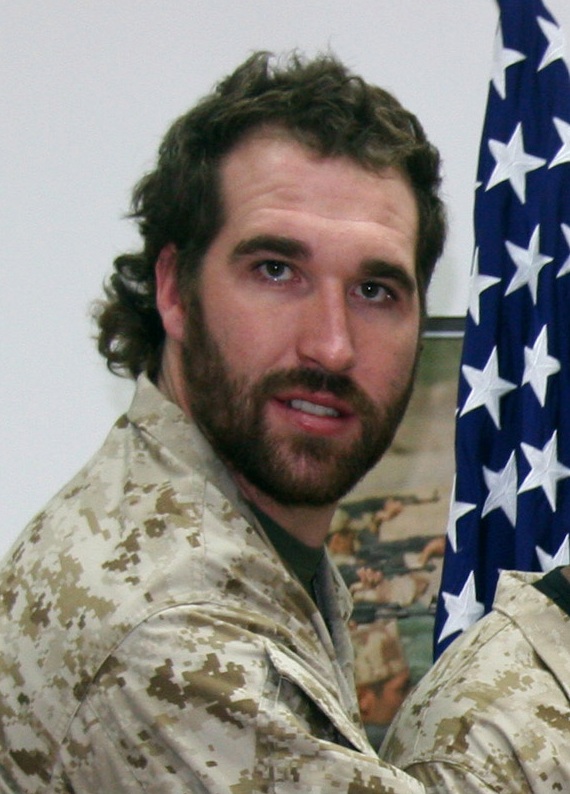 Jared Allen in a mullet hairstyle wearing a military uniform