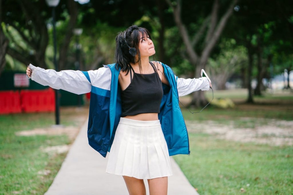 A woman wearing a white mini skirt