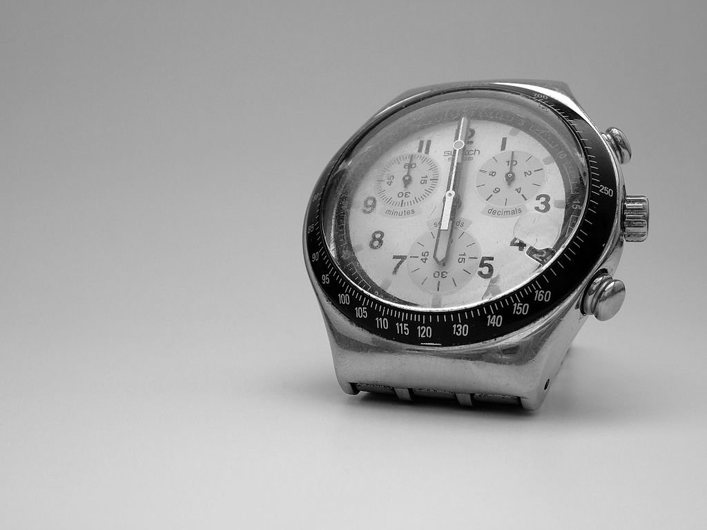 swatch watch on grey background