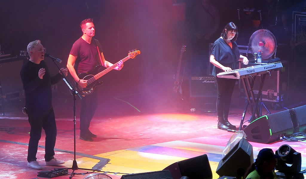 New Order band performing on stage