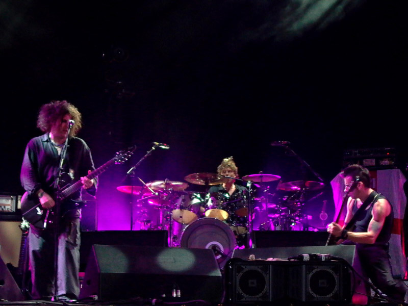 The Cure band playing on stage