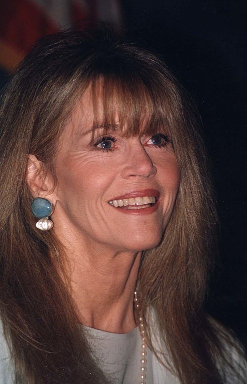 close-up of a smiling woman with bangs