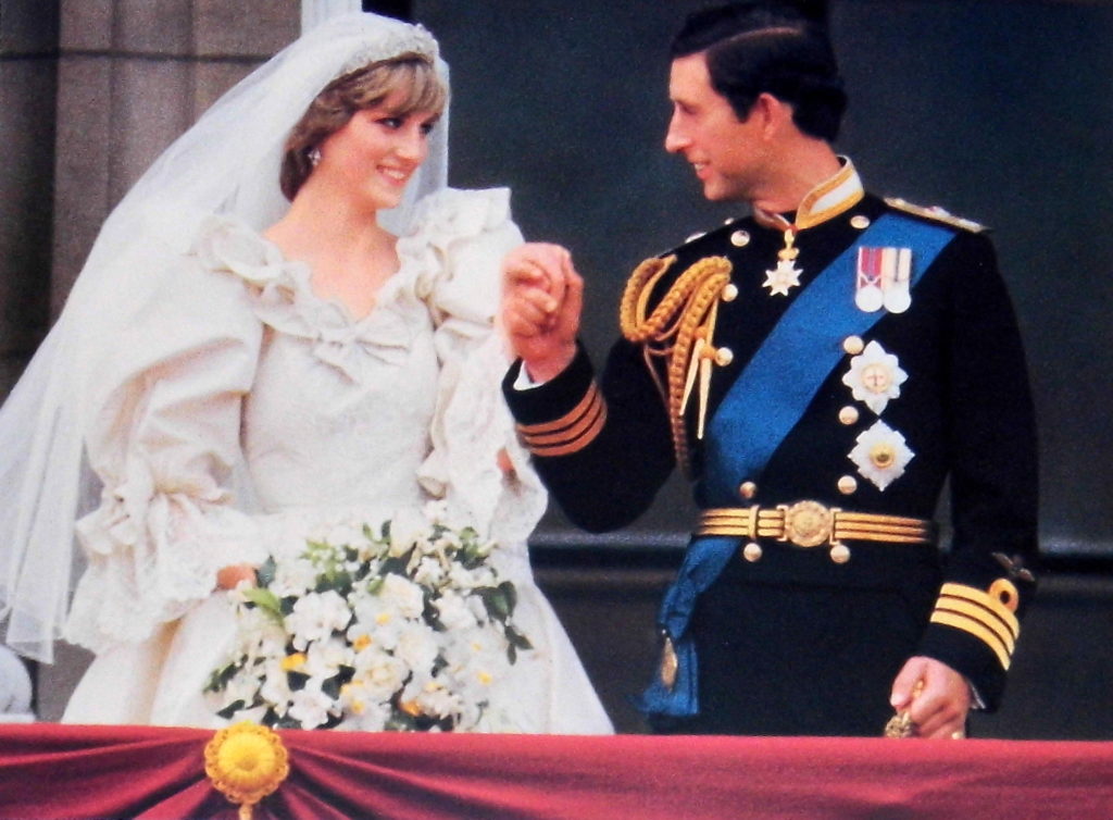 woman in a wedding dress looking at her groom